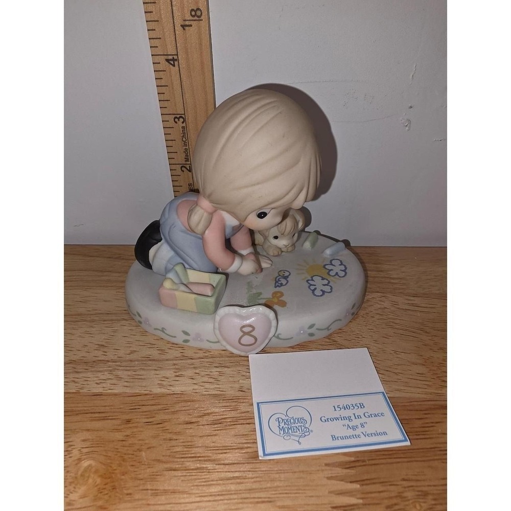 Precious Moments "Growing In Grace, Age 8" (Brunette Girl) porcelain collectible